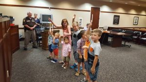 Kids raising hands at adoption day
