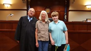Family and judge at adoption day